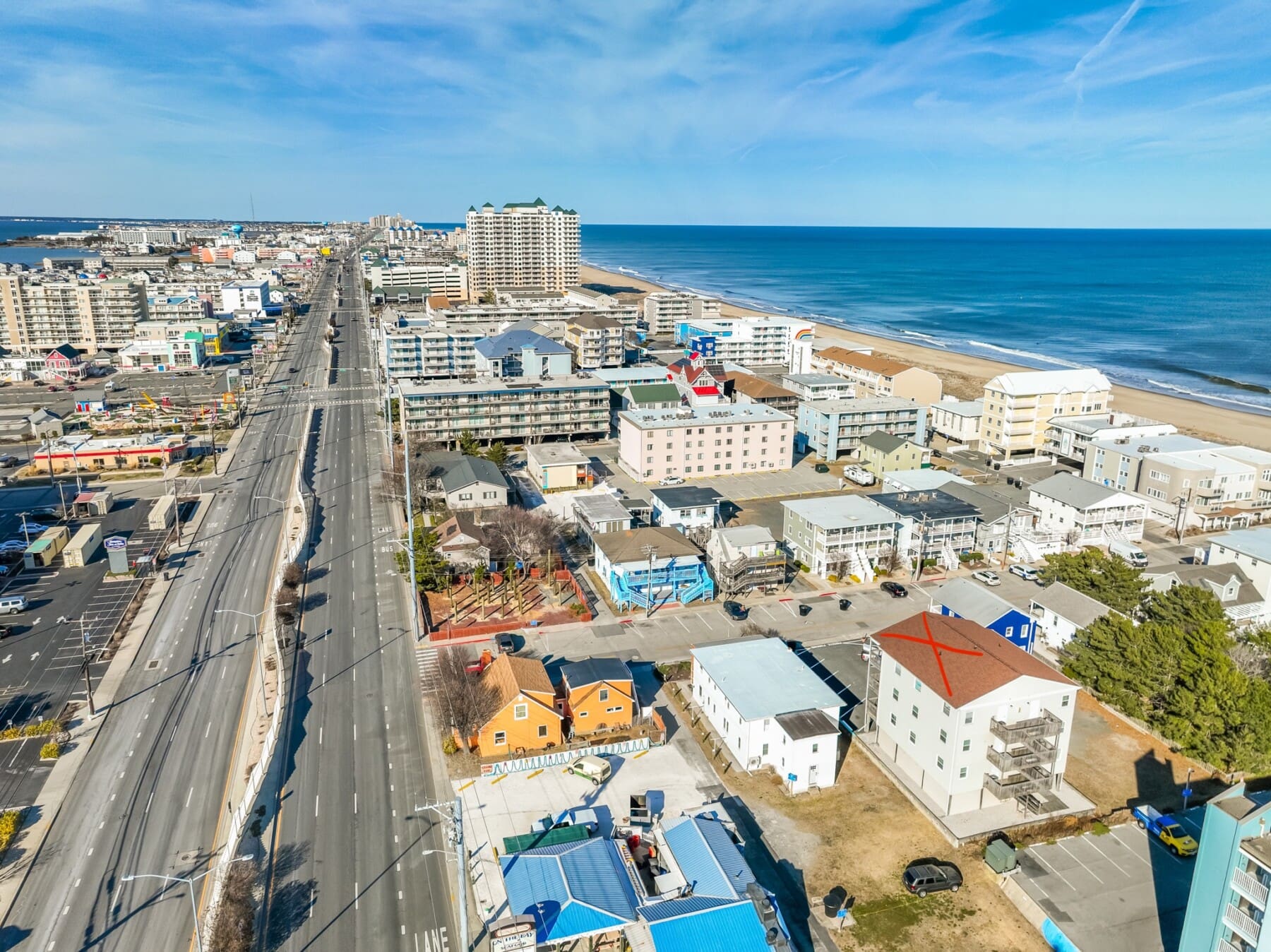 Coastal view with road and buildings.